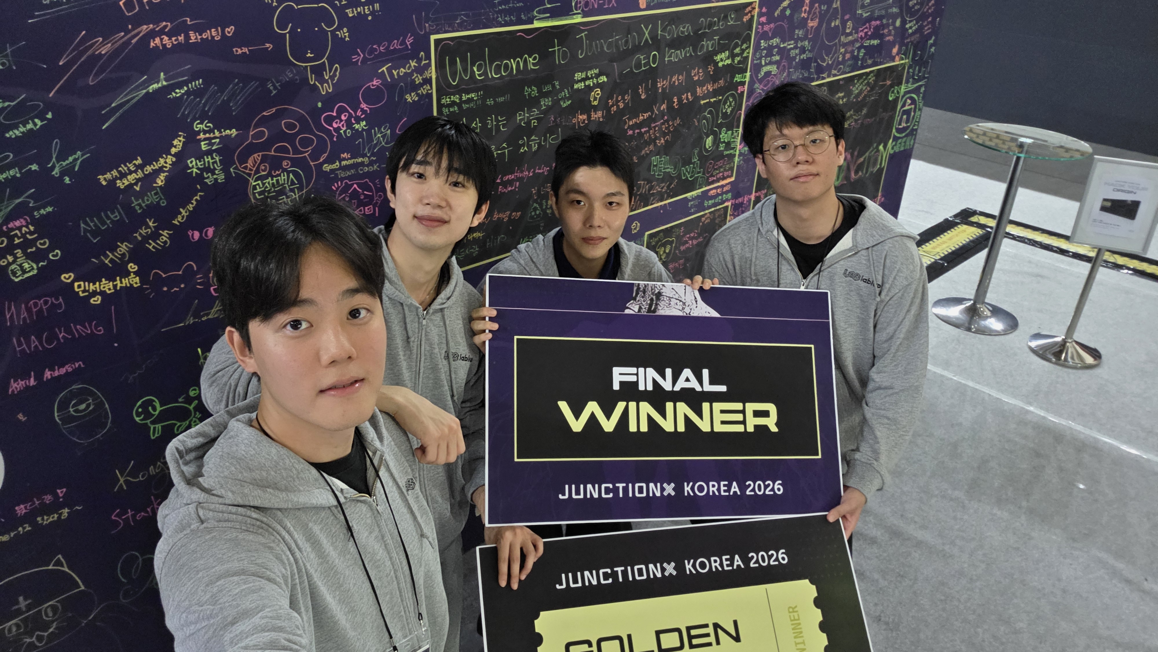 Team Demo Day Care holding the Final Winner board at JunctionX Korea 2026